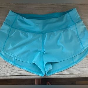 Lululemon size 4 2.5 inch low rise speed ups in electric turquoise